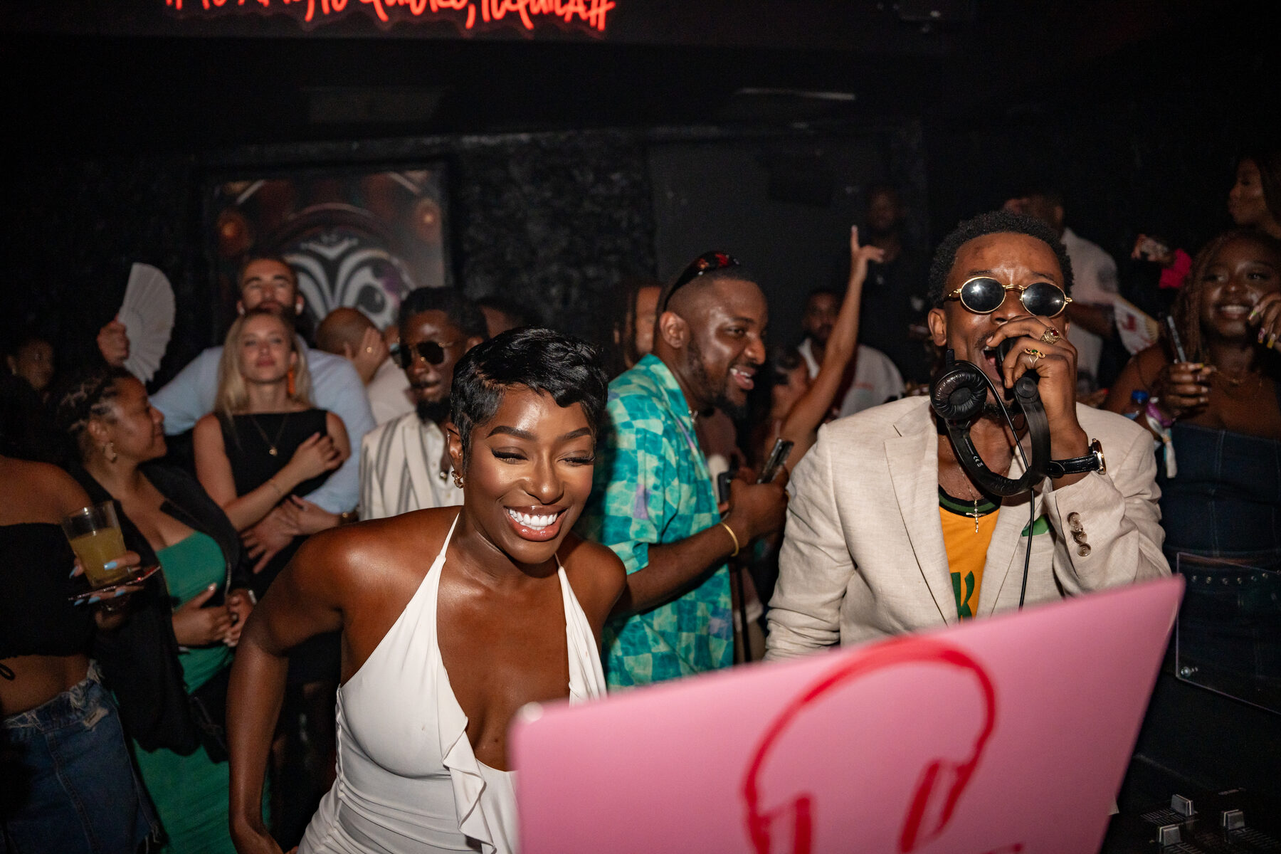 Guests dancing with hands raised