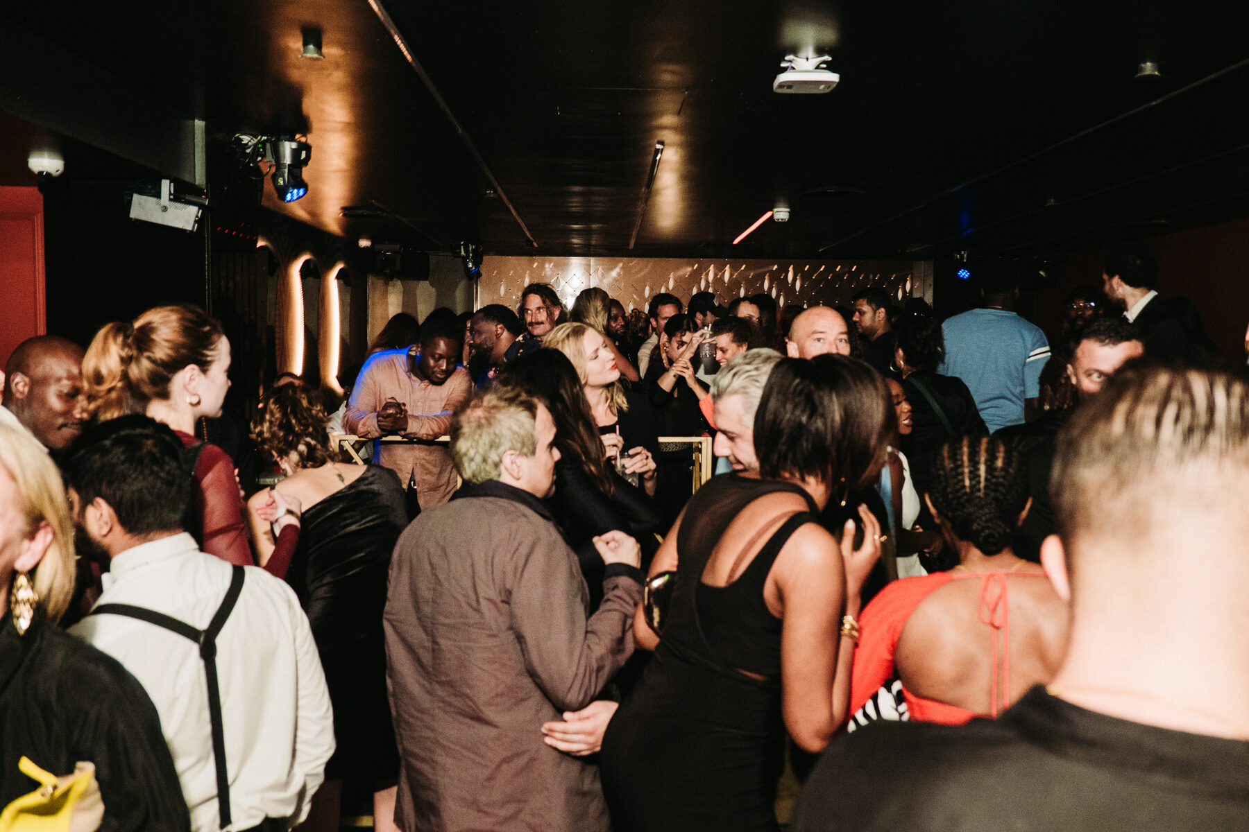 Guests gathered in a warm-lit lounge