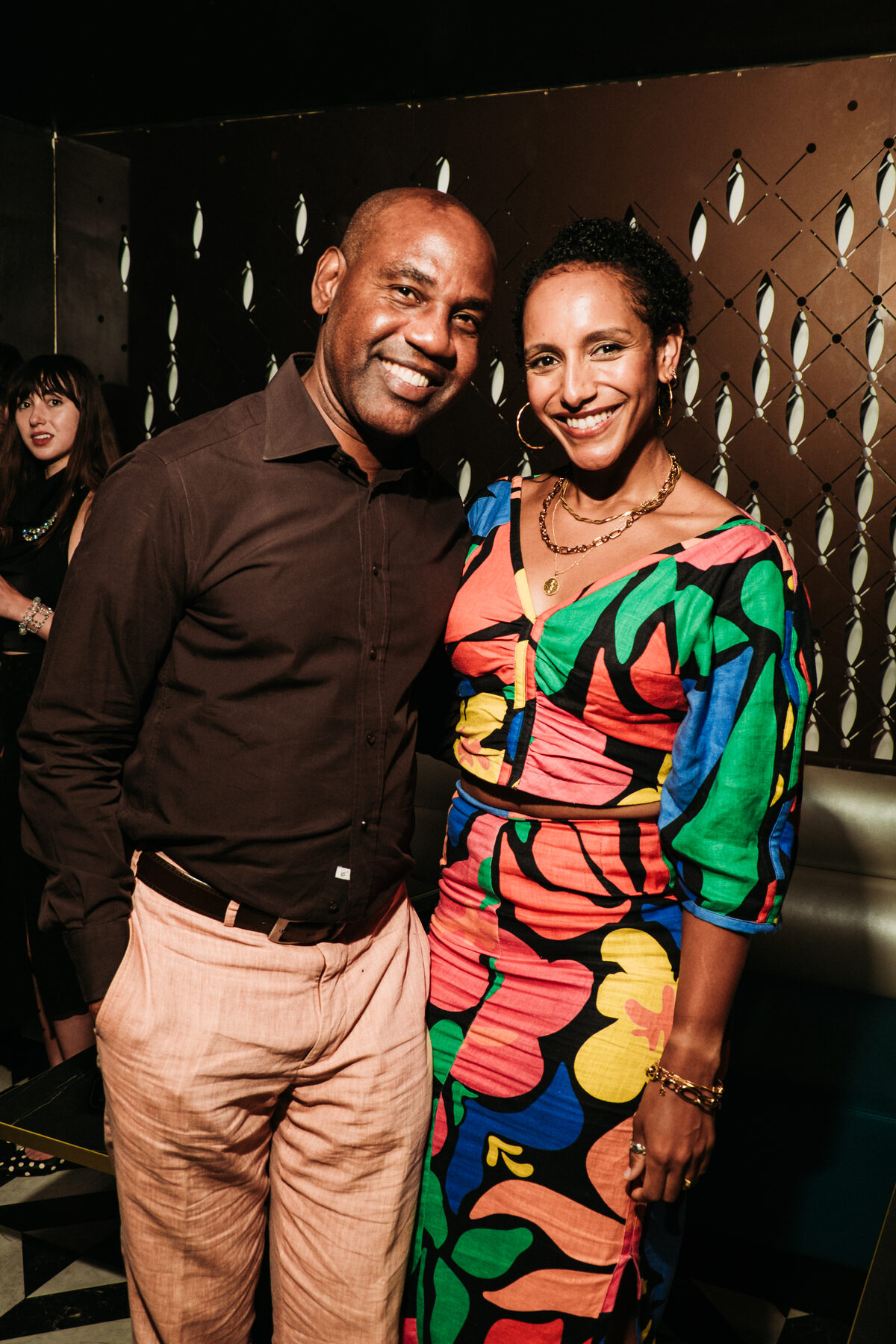 Guest in a colorful printed outfit